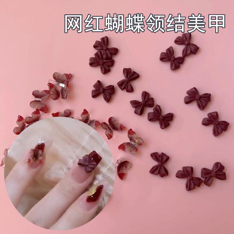 Объемные украшения для маникюра в стиле Red Velvet: красные камелии и бантики